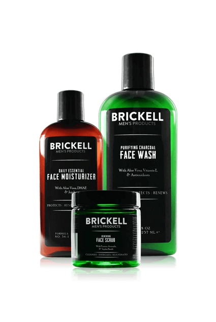 Brickell men's skincare products including face moisturizer, face wash, and face scrub in green and amber bottles.