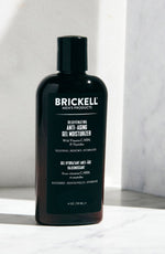 Brickell Men's Products Rejuvenating Anti-Aging Gel Moisturizer with Vitamin C, MSM, and Peptides on marble background